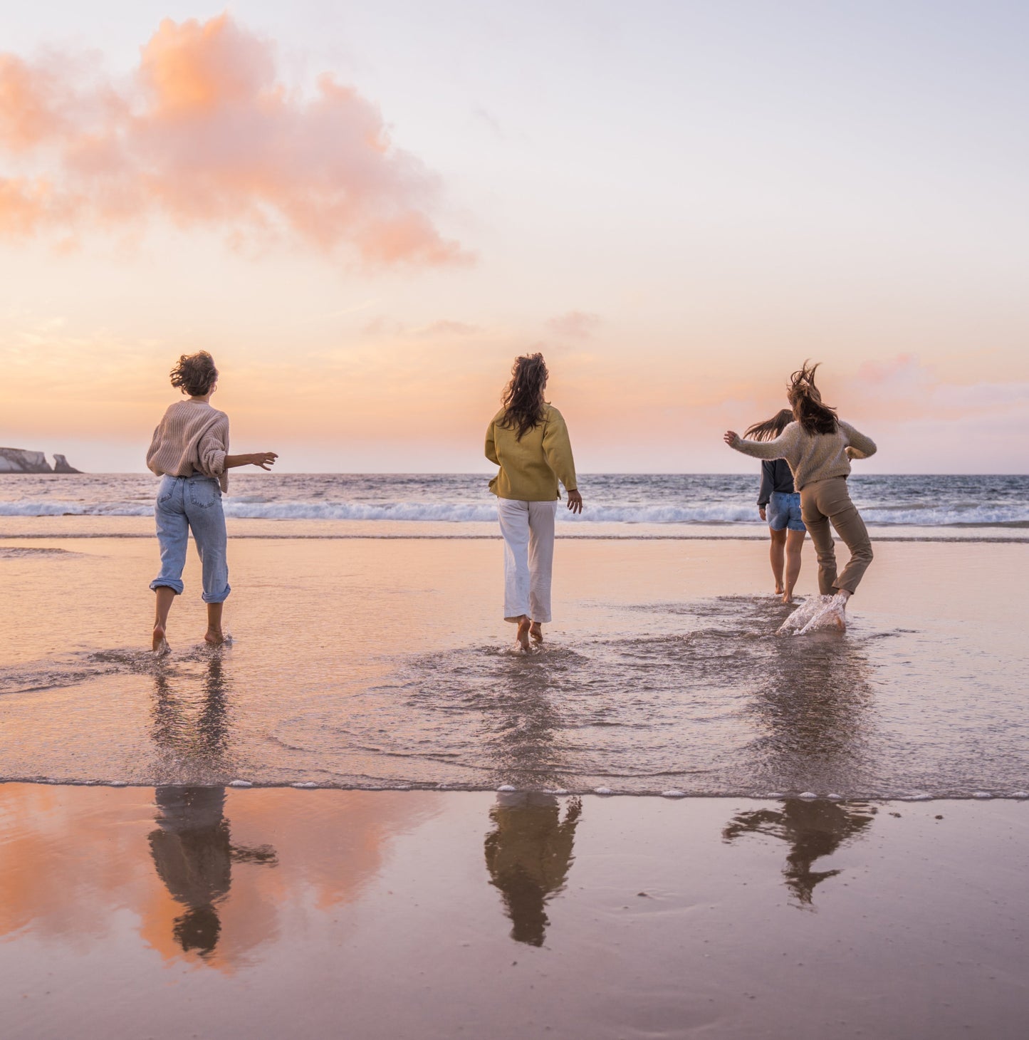 Active women having fun on the beach
